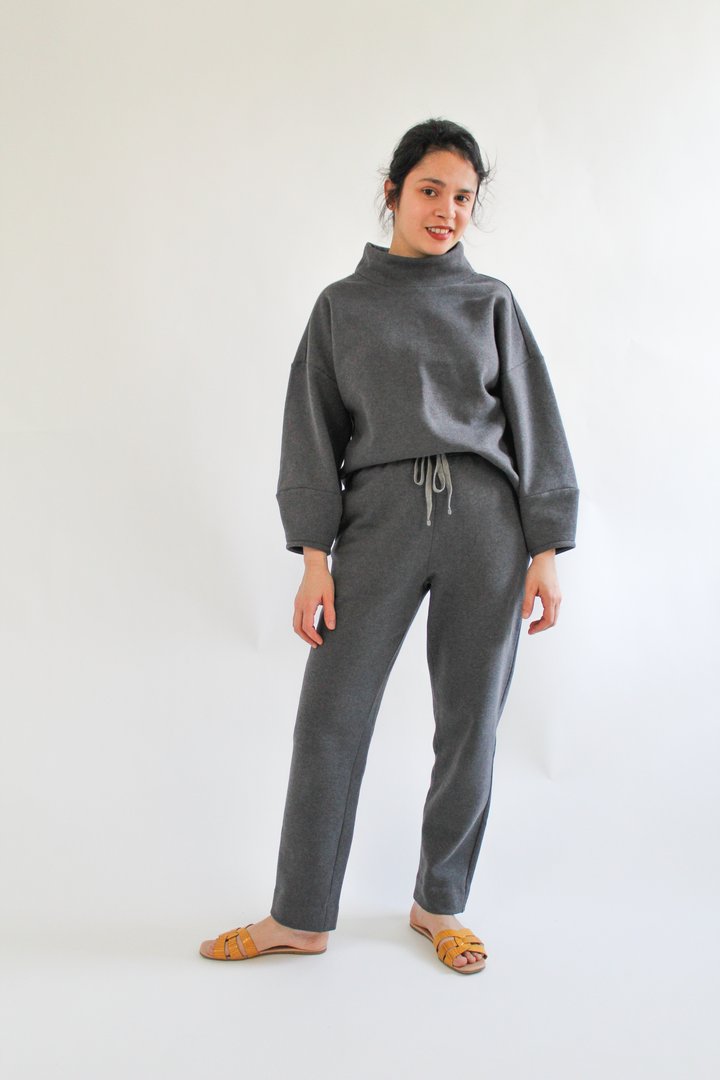 Woman wearing the Apollo Jumper sewing pattern from Bella Loves Patterns on The Fold Line. A jumper pattern made in heavy and medium weight knit fabrics, featuring an oversized fit, drop shoulders, high funnel neck, bracelet length sleeves with tapered cu