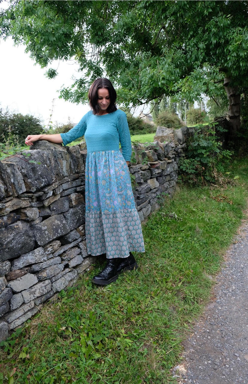 Woman wearing the Applepicker Dress sewing pattern from Sew Different on The Fold Line. A dress pattern made in jersey, scuba, double knit or ponte de roma fabrics for the bodice and light jersey, cotton, linen, viscose, silk or crepe fabrics for the skir