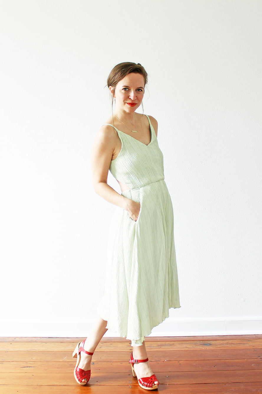 Woman wearing the Audie Playdress sewing pattern from Amy Nicole on The Fold Line. A sleeveless dress pattern made in Tencel twill, washed linen, crepe de chine, rayon challis and lighter cotton fabrics, featuring princess seams, spaghetti straps, V neckl