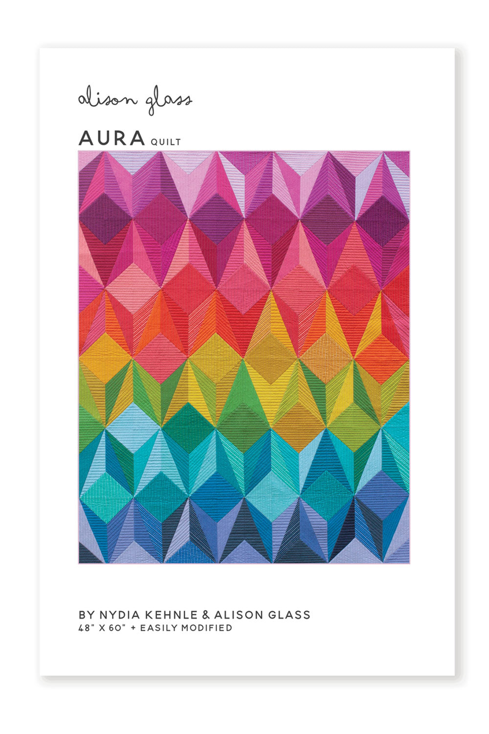 Photo showing the Aura Quilt sewing pattern from Alison Glass on The Fold Line. A quilt pattern made in quilting cotton fabrics, featuring triangles in a kaleidoscope of colours.