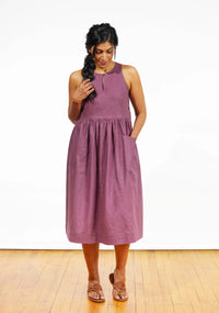 Woman wearing the Austin Dress sewing pattern from Grainline Studio on The Fold Line. A dress pattern made in cotton poplin, chambray, denim, linen, linen blends, rayon, and rayon blend fabrics featuring a semi-fit bodice, gathered skirt, sleeveless, armh