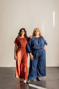 Women wearing the Avenir Jumpsuit sewing pattern from Friday Pattern Company on The Fold Line. A jumpsuit pattern made in linen, rayon or challis fabrics, featuring long billowy sleeves or short sleeves, wide legs, elastic gathers the square neck and wais