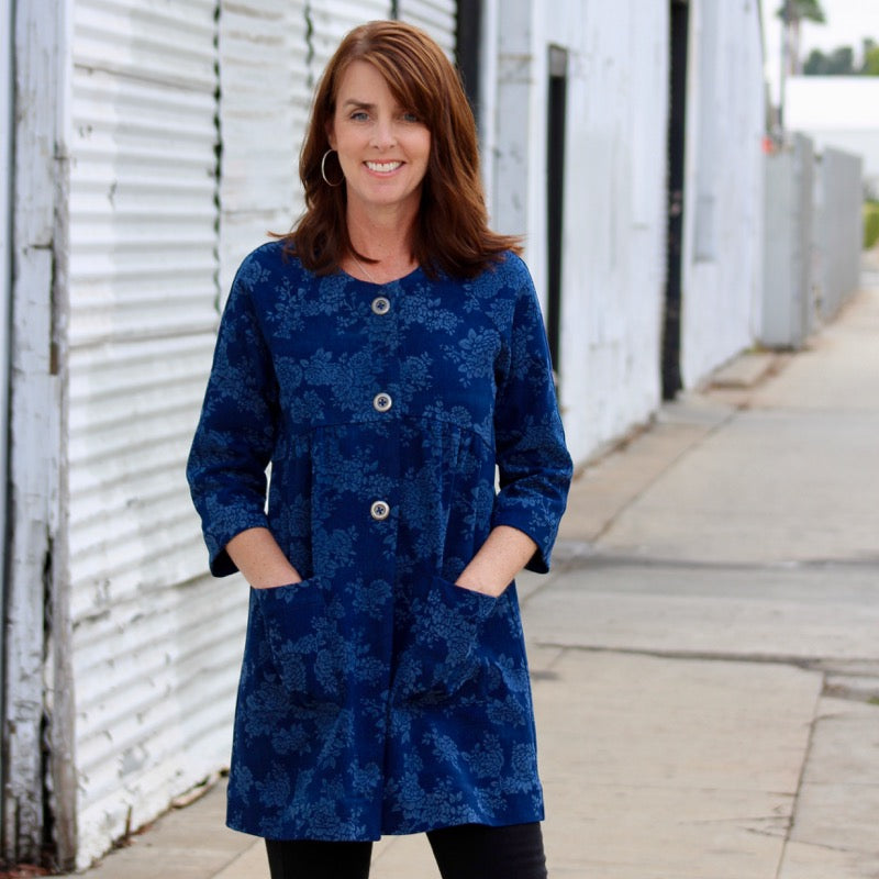 Woman wearing the Dover Jacket sewing pattern by Blue Dot Patterns. A jacket pattern made in linen, lightweight denim, lightweight wool, quilting weight cotton, raw silk or ponte knit fabrics, featuring a three quarter length raglan sleeve, three button c