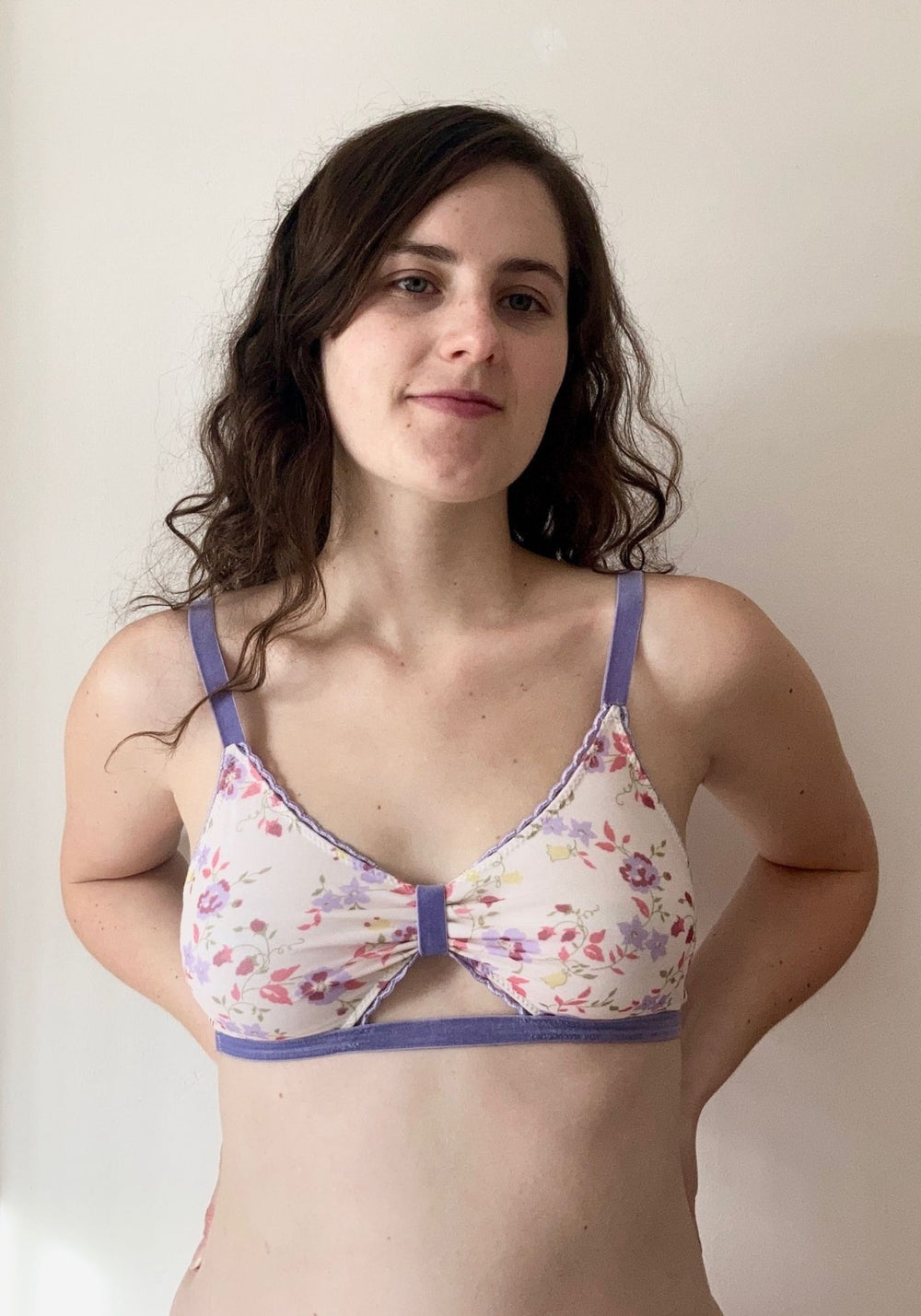 Woman wearing the Barbary Bralette sewing pattern from Sew Projects on The Fold Line. A bra pattern made in jersey, stretch satin, stretch mesh or powernet stretch lace fabrics, featuring a lined front, adjustable straps, wide elastic underband and a keyh