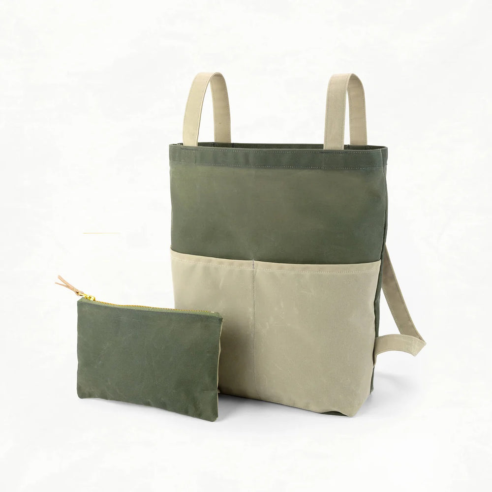 Photo showing the Belmont Pack and Pouch sewing pattern from Klum House on The Fold Line. A backpack and pouch pattern made in canvas, waxed canvas, or denim fabrics, featuring a bag that converts from tote to backpack and can be stored inside the zipper 