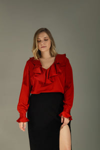 Woman wearing the Bertha Blouse sewing pattern from Vikisews on The Fold Line. A blouse pattern made in natural silk, artificial silk, chiffon, crepe de chine, organza or silk crepe fabrics, featuring a semi-fit straight silhouette, hip length, bust darts