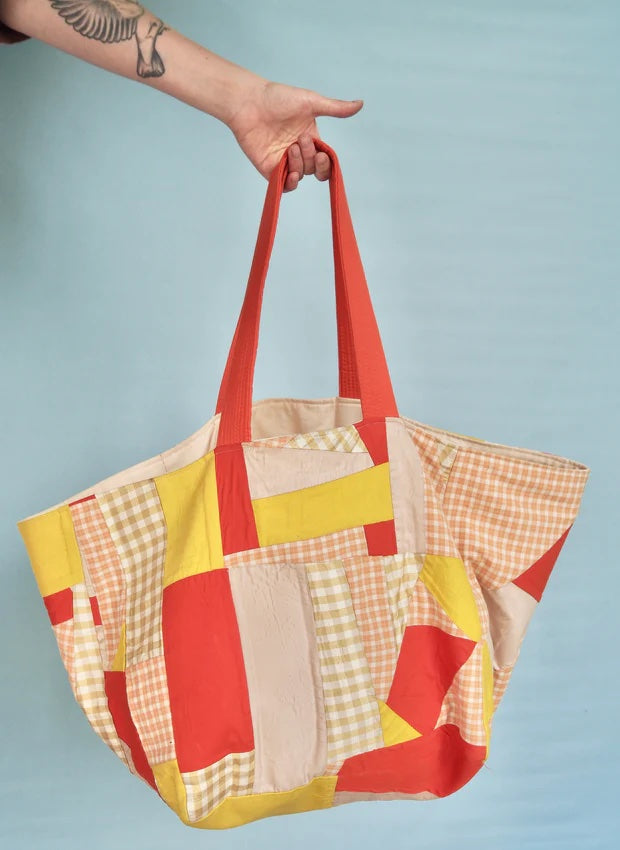 Photo showing the Biggi Bag sewing pattern from Melilot on The Fold Line. A bag pattern made in mid-heavy weight fabrics featuring a reversible style and no closure.