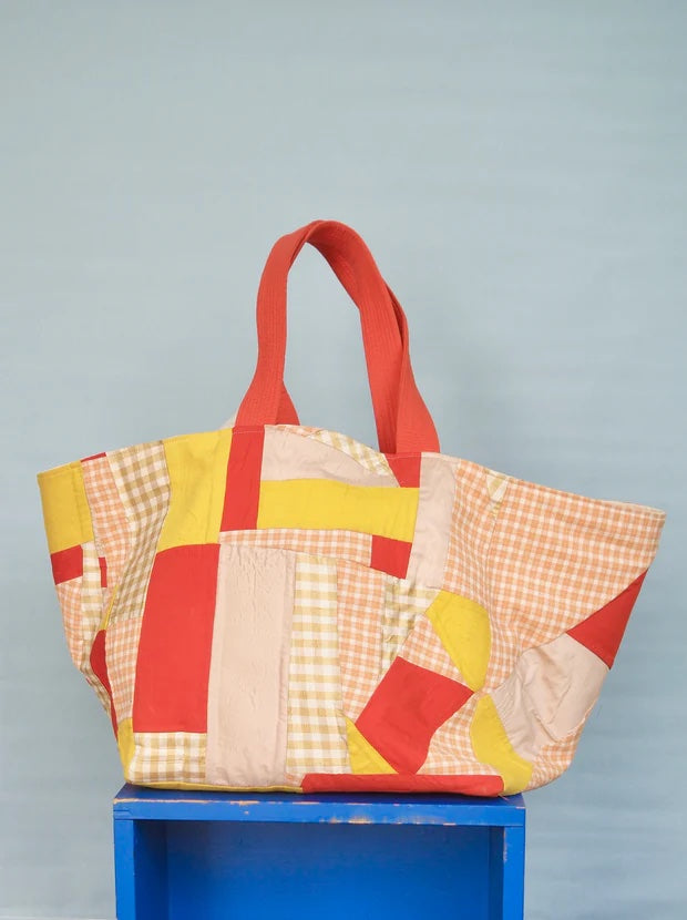 Photo showing the Biggi Bag sewing pattern from Melilot on The Fold Line. A bag pattern made in mid-heavy weight fabrics featuring a reversible style and no closure.