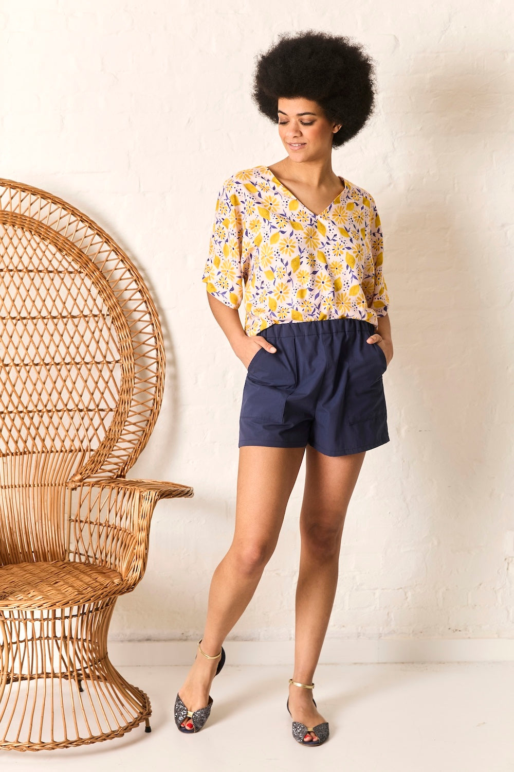Woman wearing the Billie Top and Finn Shorts sewing pattern from Atelier Jupe on The Fold Line. A top and shorts pattern made in viscose, cotton, tencel, linen, double gauze, polyester, jersey knit or french terry fabric, featuring a loose top with a v-ne