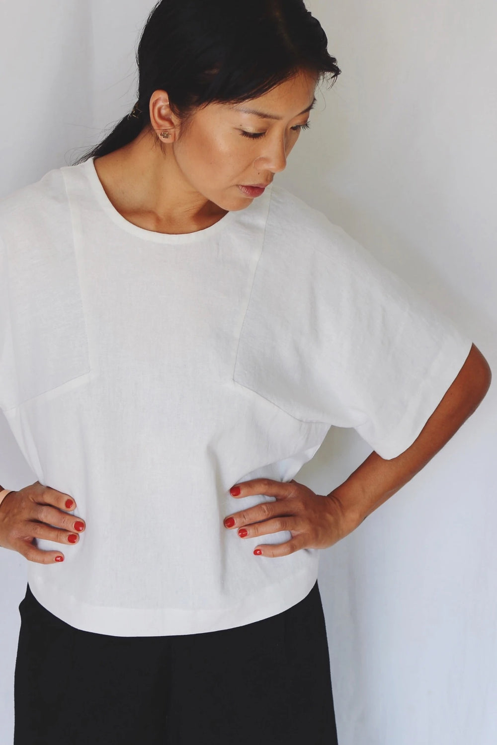 Women wearing the Block Tee sewing pattern from Paper Theory Patterns on The Fold Line. A T-shirt pattern made in linen, cotton, crepe de chine or silk fabrics, featuring a boxy silhouette, oversized fit, elbow length sleeves and round neck.