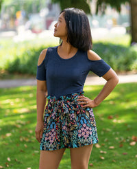 Woman wearing the Brampton Shorts sewing pattern from Itch to Stitch on The Fold Line. A shorts pattern made in crepe, viscose/rayon twill or Tencel twill fabrics, featuring a paper-bag-style high-waist, elastic waist, belt loops, detachable sash, side se