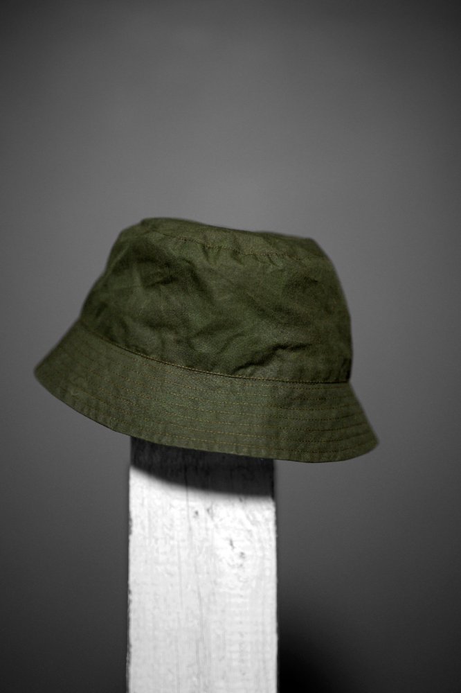 Photo showing the Free Bucket Hat sewing pattern from Merchant & Mills on The Fold Line. A hat pattern made in oilskin, dry oilskin, mid weight cotton canvas or drill, or mid weight denim fabrics, featuring a lining, decorative band, stitching details and