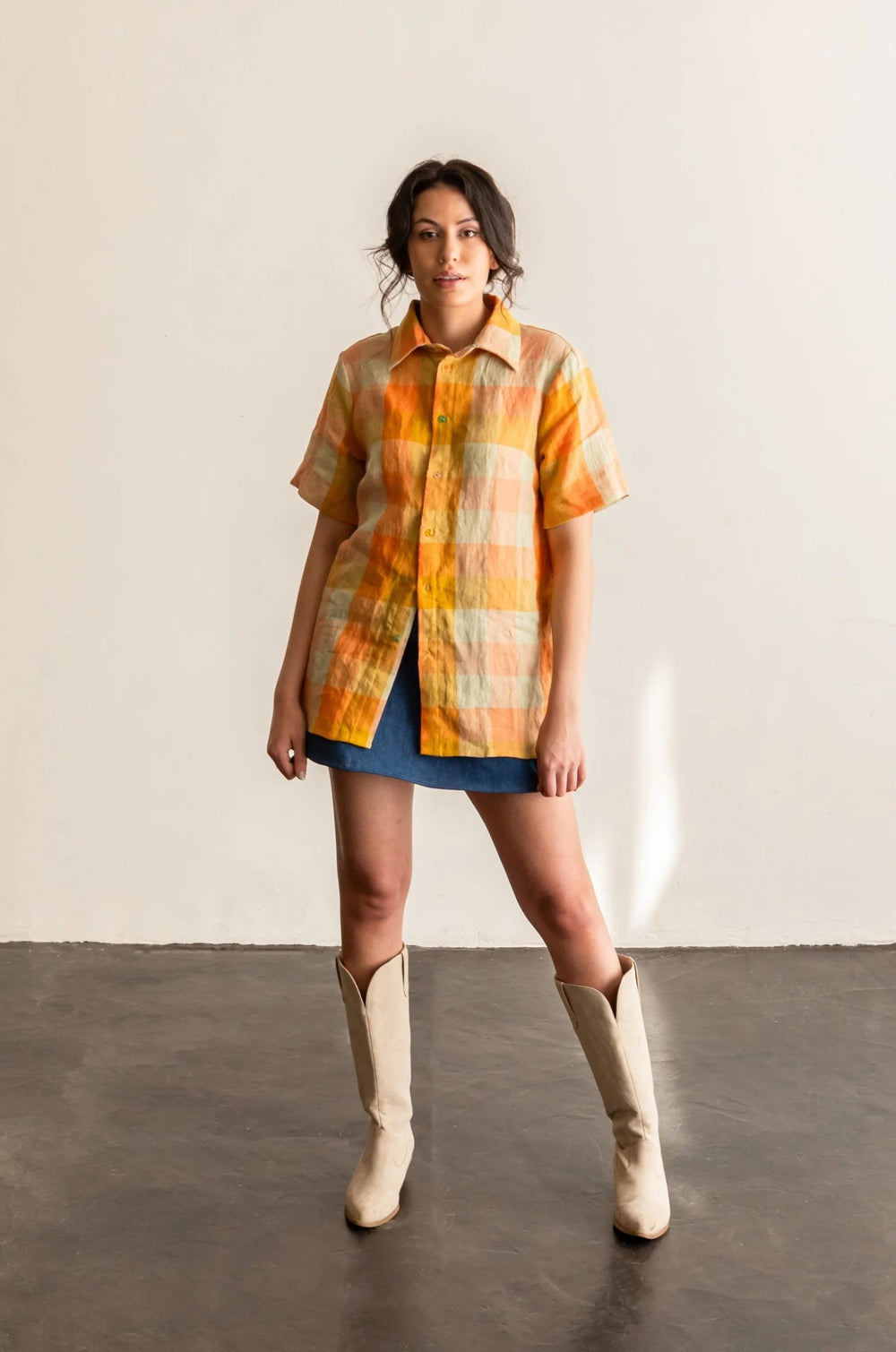 Woman wearing the Butano Button Up sewing pattern from Friday Pattern Company on The Fold Line. A shirt pattern made in linen, cotton, twill, denim, rayon challis, or silk fabric, featuring a relaxed fit, collar and stand, button front, bust darts, and sh