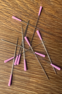 Magic Pins: Extra-Long (0.6 mm) from Taylor Seville on The Fold Line. 50 pins featuring a patented comfort grip silicone head and a super sharp point.