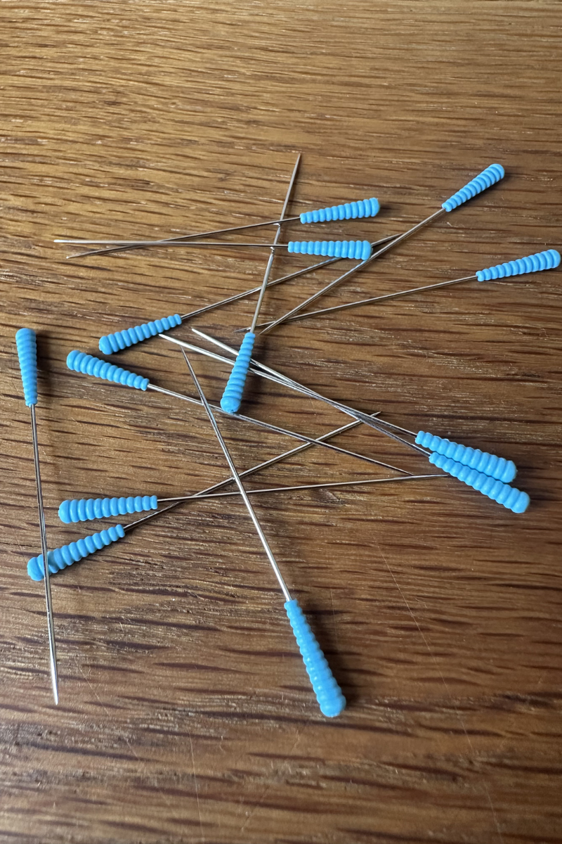 Magic Pins: Regular (0.6 mm) from Taylor Seville on The Fold Line. 50 pins featuring a patented comfort grip silicone head and a super sharp point.