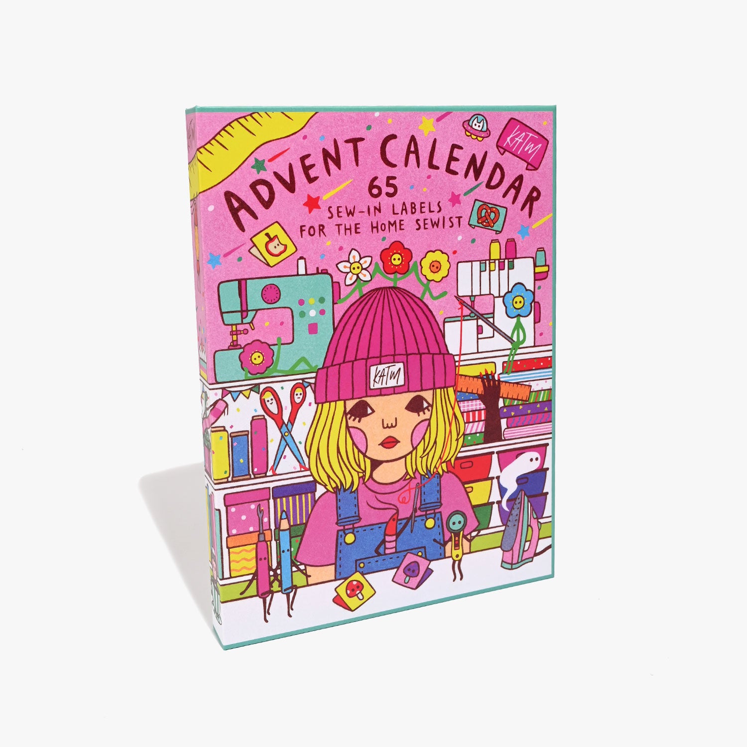 The 2025 Advent Calendar from Kylie & The Machine on The Fold Line. The calendar features 65 premium polyester woven labels, including 44 brand new KATM labels and 21 artist collaboration labels (Naoshi x KATM).