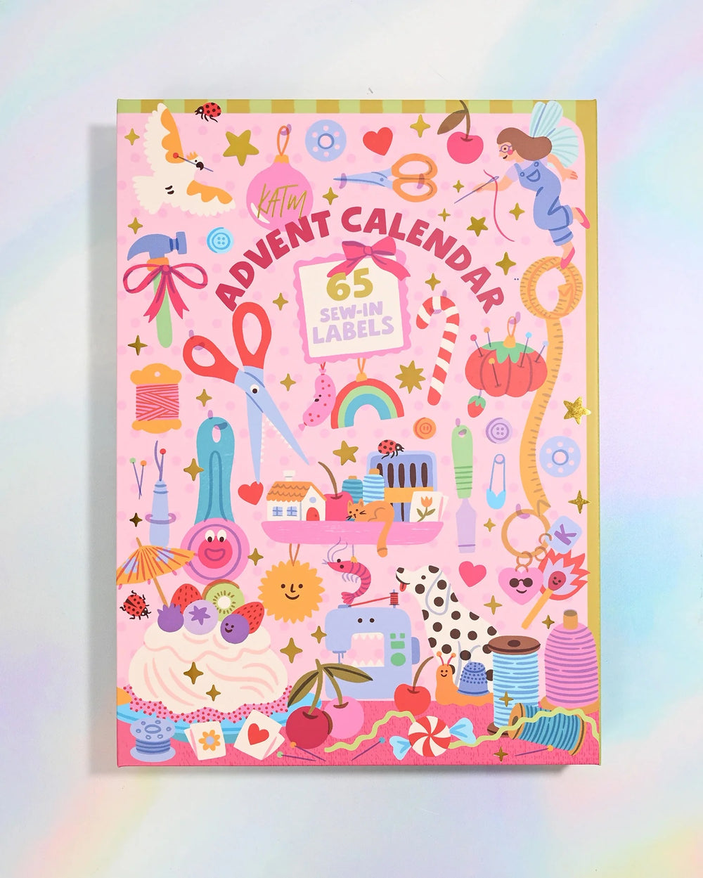 The 2026 Advent Calendar from Kylie & The Machine on The Fold Line. The calendar features 65 premium polyester woven labels: 36 brand new KATM labels and 29 artist collaboration labels (Lisa Koesterke x KATM).