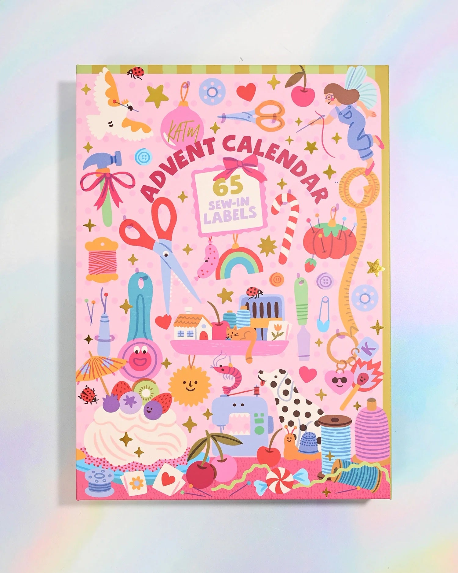 The 2026 Advent Calendar from Kylie & The Machine on The Fold Line. The calendar features 65 premium polyester woven labels: 36 brand new KATM labels and 29 artist collaboration labels (Lisa Koesterke x KATM).