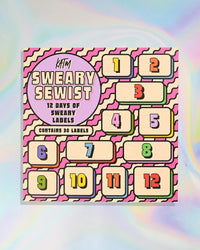 The 2026 Sweary Sewist Advent Calendar from Kylie & The Machine on The Fold Line. The calendar features 30 premium polyester woven labels in 12 windows.