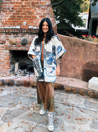 Woman wearing the Ara Quilted Overcoat sewing pattern from Daisy Chain Patterns on The Fold Line. A jacket pattern made in cotton lawn or poplin, quilting cotton, lightweight canvas, linen and linen blend, or pre-quilted fabric, featuring short sleeves and layered patch pockets.