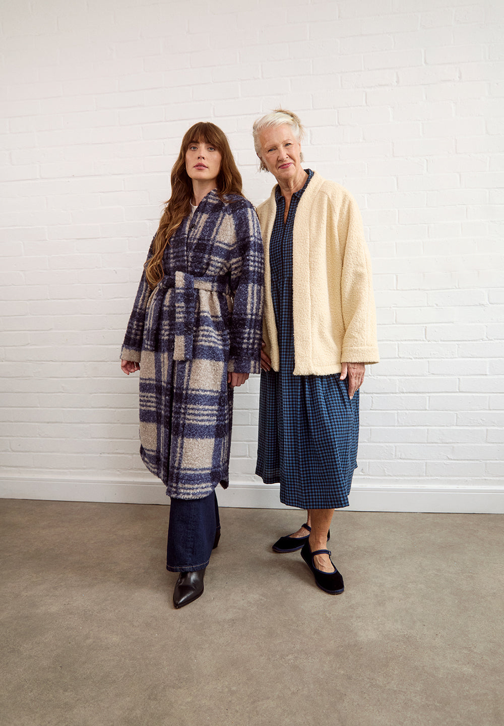 Women wearing the Arbre Coat sewing pattern from Fabric Godmother on The Fold Line. A coat pattern made in boiled wool, felt, puffer, denim, fleece, sherpa, quilted or jacquard fabric, featuring a relaxed fit, raglan sleeves, hip or mid-calf length, and press studs or a tie belt.
