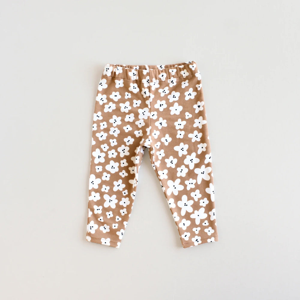 The Baby/Child Acorn Leggings sewing pattern from Oh Me Oh My Sewing on The Fold Line. A leggings pattern made in jersey, rib knit, or waffle knit fabric, featuring a snug fit and elastic waist.
