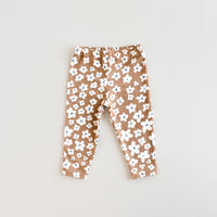 The Baby/Child Acorn Leggings sewing pattern from Oh Me Oh My Sewing on The Fold Line. A leggings pattern made in jersey, rib knit, or waffle knit fabric, featuring a snug fit and elastic waist.