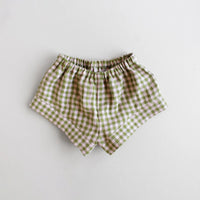The Baby/Child Fauna Shorts sewing pattern from Oh Me Oh My Sewing on The Fold Line. A shorts pattern made in quilting cotton, washed linen, double gauze, cotton lawn, voile, or rayon challis fabric, featuring an elastic waist and comfy fit.