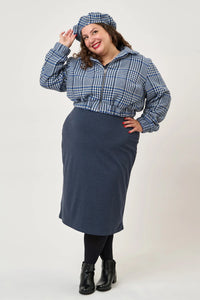 Woman wearing the Beret sewing pattern from Sew Over It on The Fold Line. A hat pattern made in cotton twill, denim, jumbo corduroy, needlecord, cotton poplin, or melton wool fabric, featuring a lining and neatly finished with bias binding.