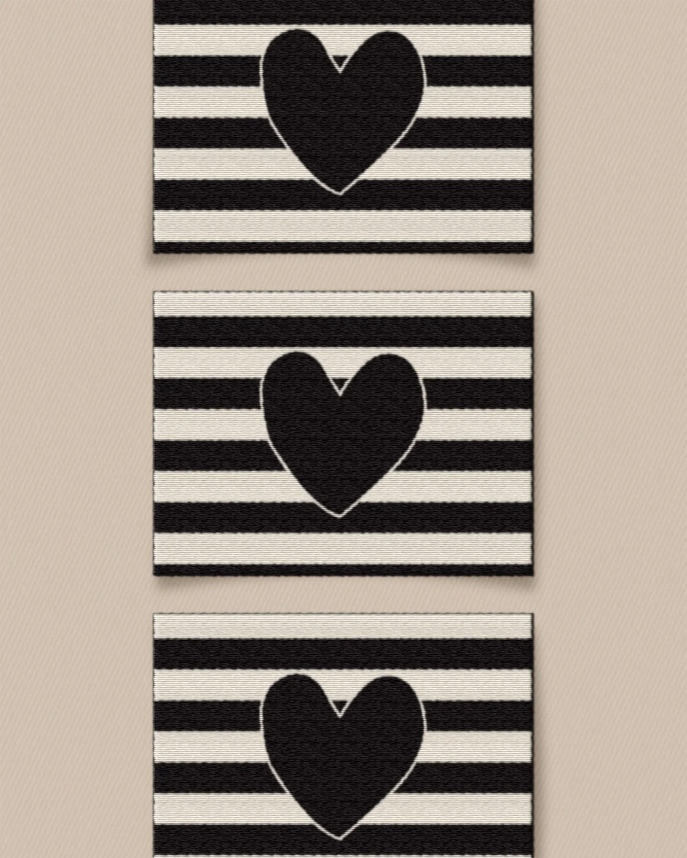 'Black Heart Large' woven labels from Matchy Matchy Sewing Club on The Fold Line. The pack includes 6 woven labels to sew onto your handmade clothes and accessories.