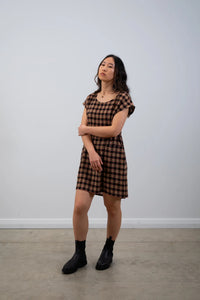 Woman wearing the Botany Tunic sewing pattern from Elbe Textiles on The Fold Line. A dress pattern made in washed linen, cotton chambray, rayon, double gauze cotton, hemp, or linen/viscose fabric, featuring a round neckline, grown-on short sleeves, dartless bodice, pockets, and mini length.