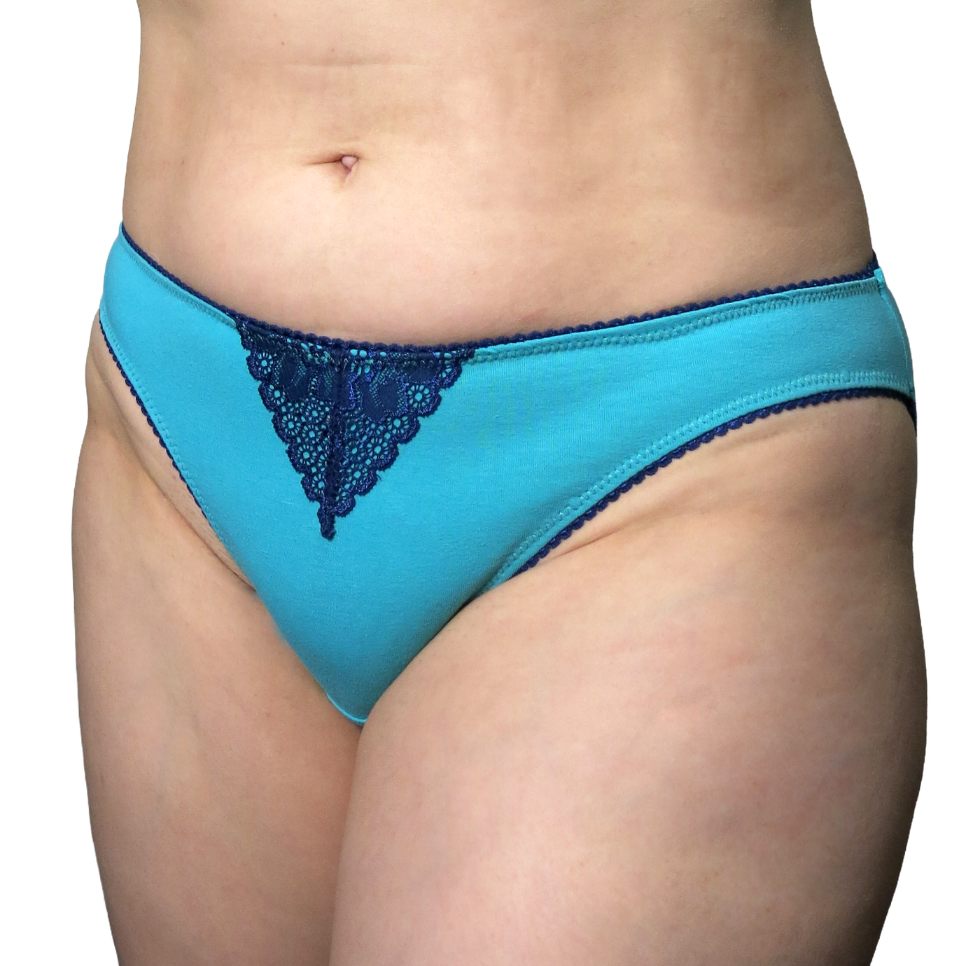 Woman wearing the Britta Bikini sewing pattern from Primrose Dawn on The Fold Line. An underwear pattern made in stretch knit fabric, featuring a low rise, high leg openings, and moderate back coverage.