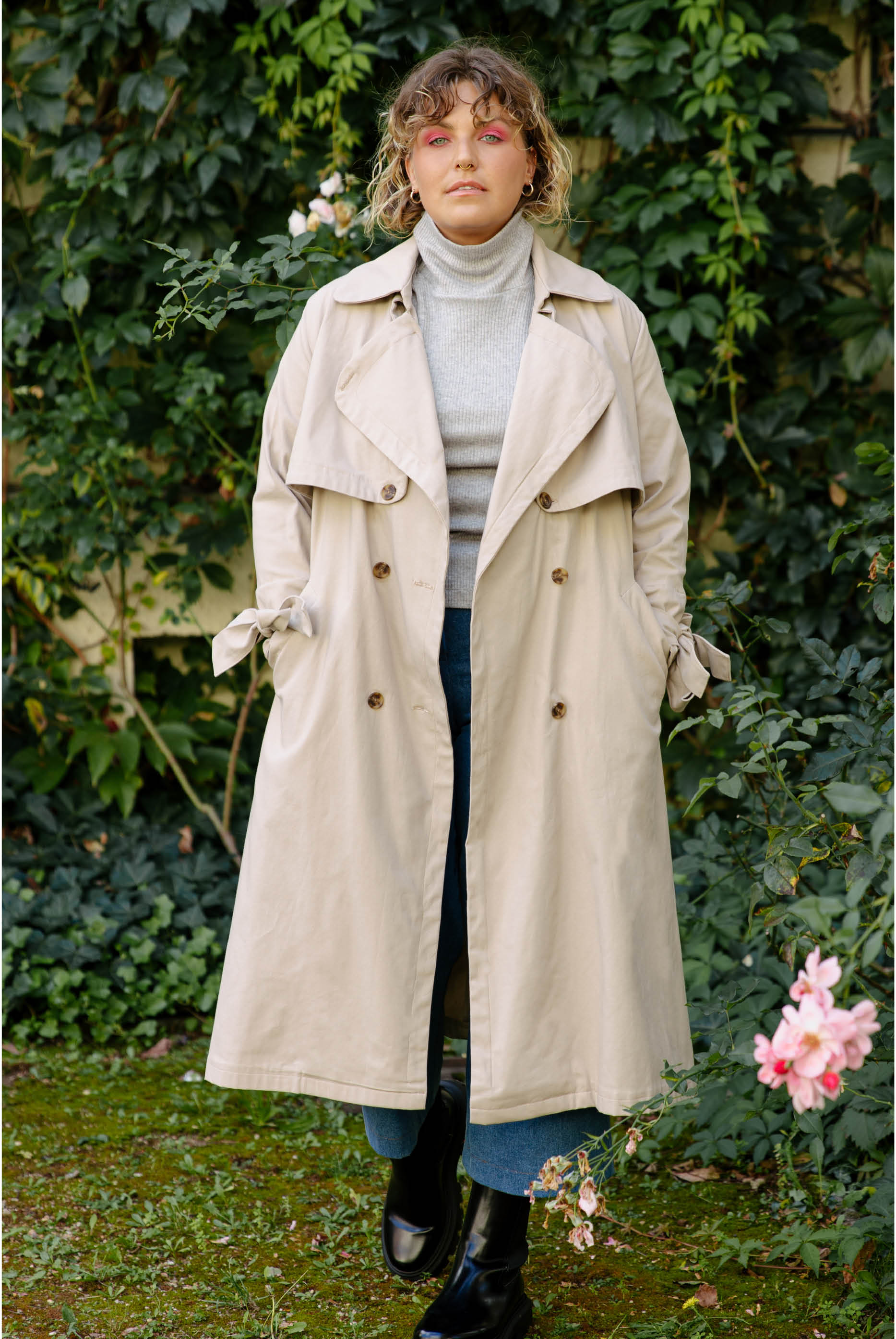 Woman wearing the Chloe Trench Coat sewing pattern from JULIANA MARTEJEVS on The Fold Line. A trench coat pattern made in viscose twill fabric, featuring a relaxed fit, oversized collar, and ties on the cuffs.