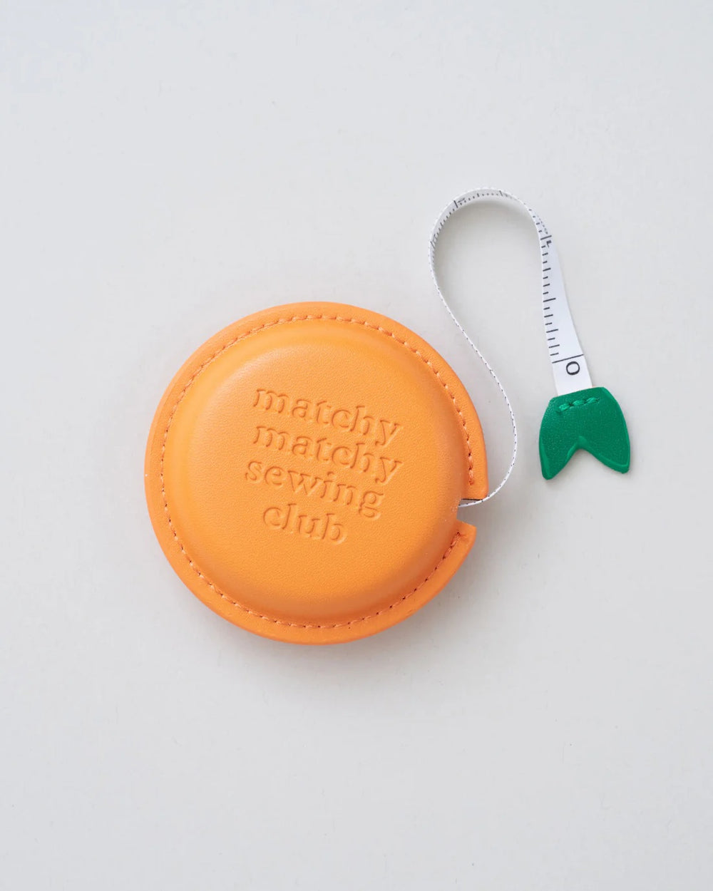 The Clementine Measuring Tape from Matchy Matchy Sewing Club on The Fold Line. This retractable soft measuring tape measures up to 60" (150 cm).