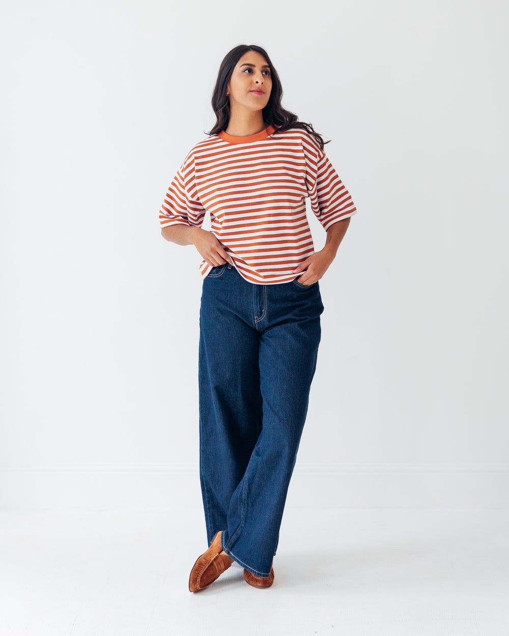 Woman wearing the Cloud Tee sewing pattern from Tammy Handmade on The Fold Line. A T-shirt pattern made in knit fabric, featuring an oversized fit, wide neckband, dropped shoulders, and elbow length sleeves.