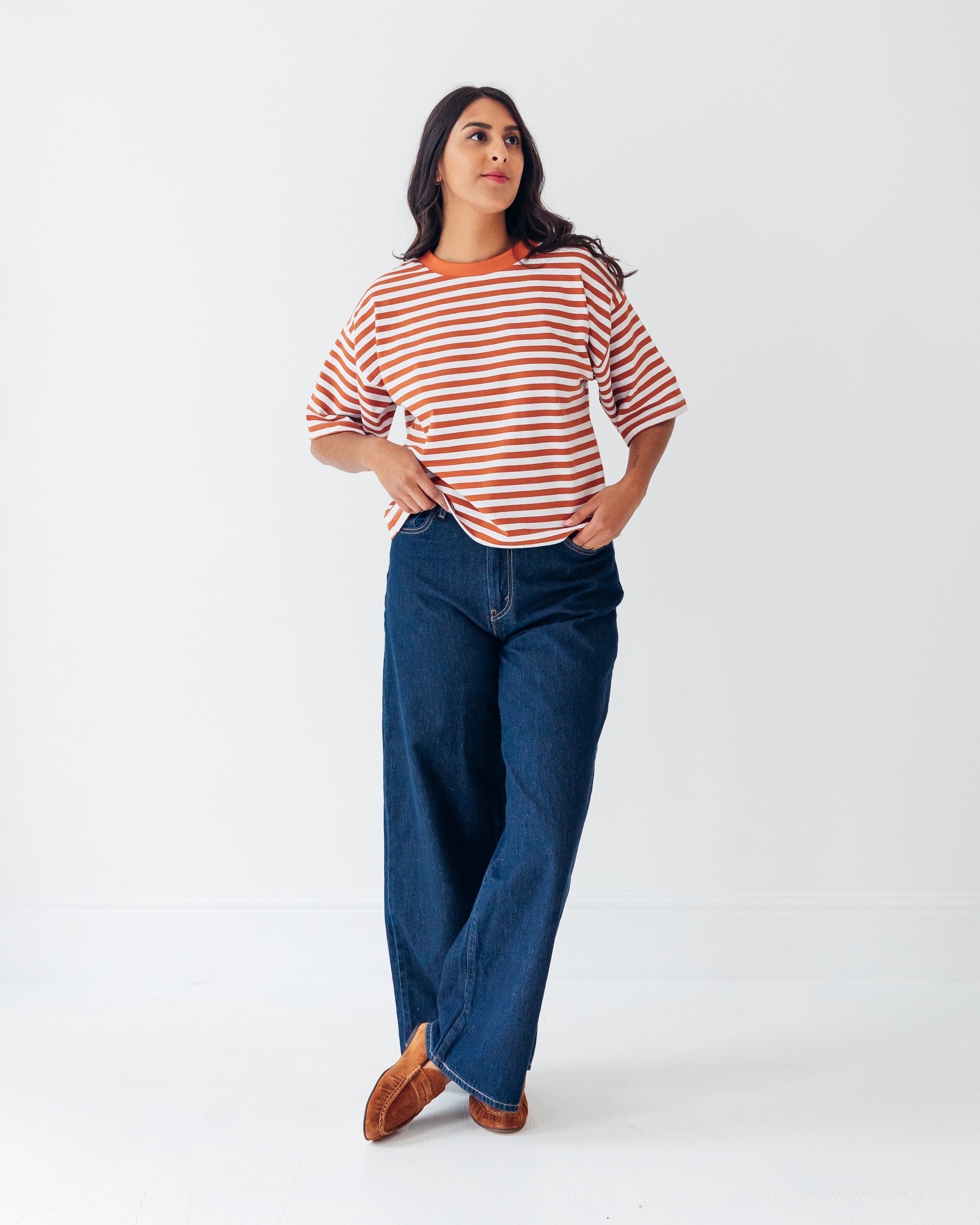 Woman wearing the Cloud Tee sewing pattern from Tammy Handmade on The Fold Line. A T-shirt pattern made in knit fabric, featuring an oversized fit, wide neckband, dropped shoulders, and elbow length sleeves.