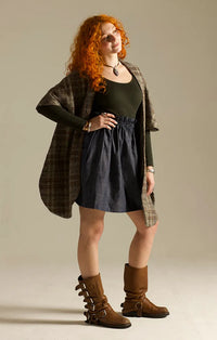 Woman wearing the Corvus Stole sewing pattern from Sew Different on The Fold Line. A fully lined stole or cape pattern made in wool, boucle, faux fur, or tweed fabric.