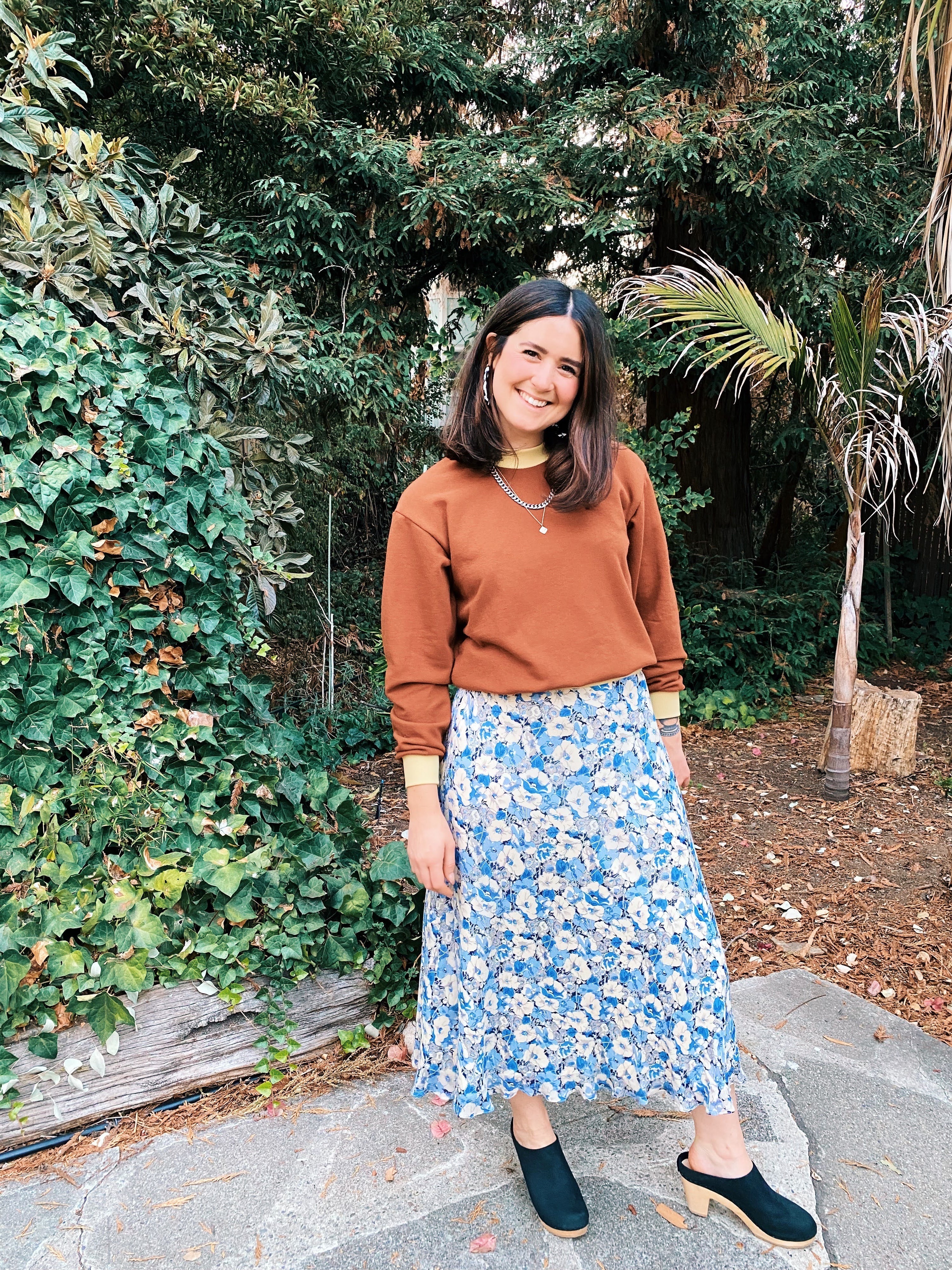 Woman wearing the Dale Sweatshirt sewing pattern from Daisy Chain Patterns on The Fold Line. A sweatshirt pattern made in sweatshirt fleece, french terry, or sweater knit fabric, featuring a relaxed fit, slightly cropped body, long sleeves, and rib trim.