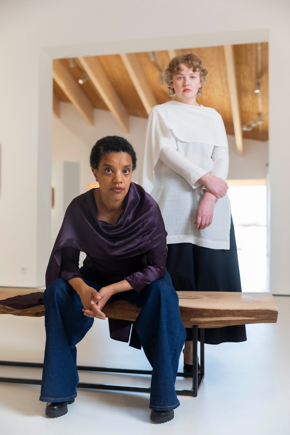 Women wearing the Dorte Blouse or Tunic sewing pattern from TAUKO on The Fold Line. A top pattern made in cotton, linen, silk, viscose, or tencel fabric, featuring long raglan sleeves and an attached shawl.