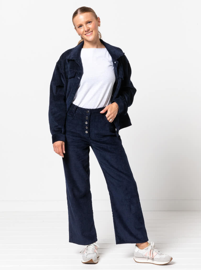 Woman wearing the Elwood Jean sewing pattern from Style Arc on The Fold Line. A jeans pattern made in denim, corduroy, or drill fabric, featuring a shaped waistband that sits on the waist, button fly, and straight 7/8 length leg.