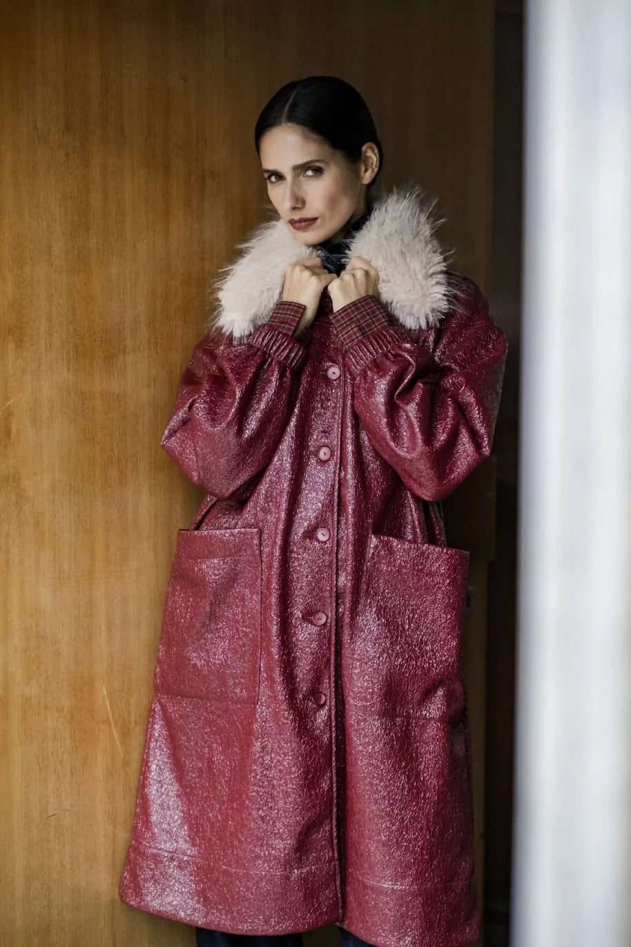 Woman wearing the Esme Jacket sewing pattern from Fibre Mood on The Fold Line. A lined coat pattern made in wool, bouclé, felt, flannel, jacquard, coated or waxed cotton, denim, corduroy, or quilted fabric, featuring an oversized fit, detachable faux fur collar, button front, patch pockets, and knee length.