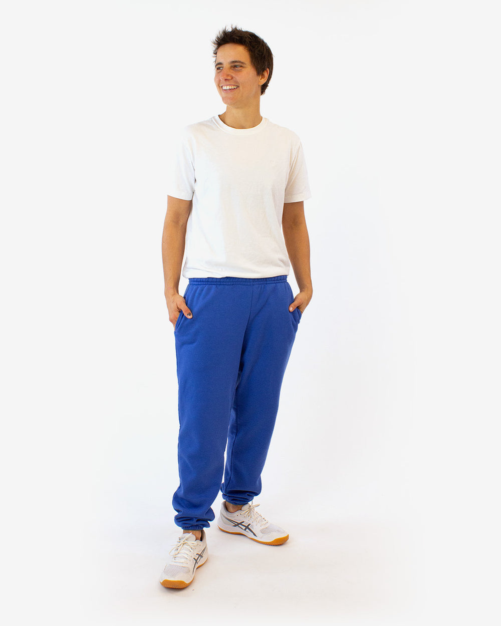 Man wearing the Evergreen Sweatpants sewing pattern from Helen's Closet on The Fold Line. A joggers pattern made in knit fabric, featuring a mid-rise, elastic waistband, in-seam pockets, tapered leg, and elastic hem.