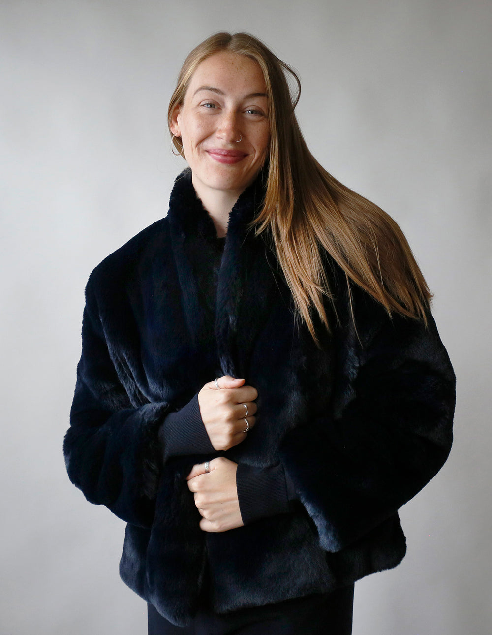 Woman wearing the Faux Fur Jacket sewing pattern from The Maker's Atelier on The Fold Line. A lined jacket pattern made in faux fur fabric, featuring a shawl collar and side seam pockets.