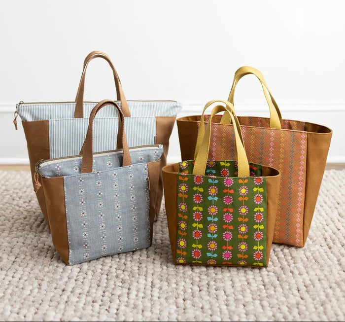 The Fieldstone Tote sewing pattern from Noodlehead on The Fold Line. A tote bag pattern made in mid-weight canvas fabric, featuring two sizes and an interior hang zip pocket or a zip top with an interior slip pocket.