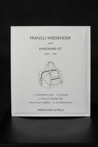The Francli Weekender Bag Hardware Kit (Fern) from Merchant & Mills on The Fold Line. The kit includes rivets, G hooks, leather tabs, webbing, and water repellent zips.