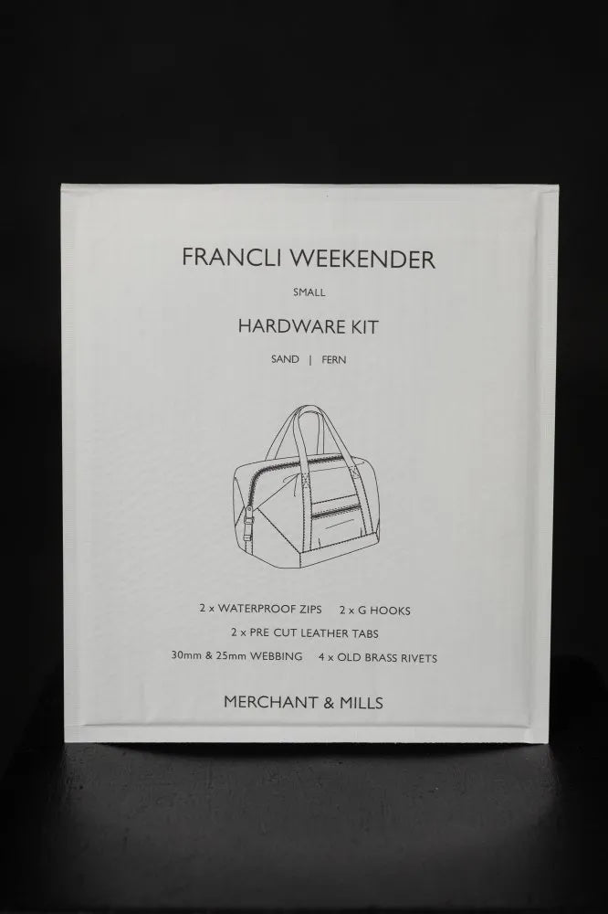 The Francli Weekender Bag Hardware Kit (Sand) from Merchant & Mills on The Fold Line. The kit includes rivets, G hooks, leather tabs, webbing, and water repellent zips.