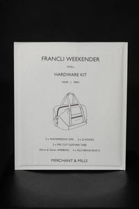 The Francli Weekender Bag Hardware Kit (Sand) from Merchant & Mills on The Fold Line. The kit includes rivets, G hooks, leather tabs, webbing, and water repellent zips.