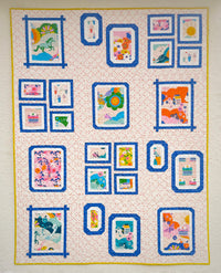 The Gallery Wall Quilt sewing pattern from Lou Orth Designs on The Fold Line. A quilt pattern made in quilting cotton fabric, featuring a four-block design.