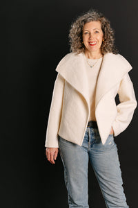 Woman wearing the Helsinki Jacket sewing pattern from Liesl + Co on The Fold Line. A jacket pattern made in linen, canvas, denim, brocade, or wool coating fabric, featuring a relaxed fit, oversized collar, dropped sleeves, and side pockets.