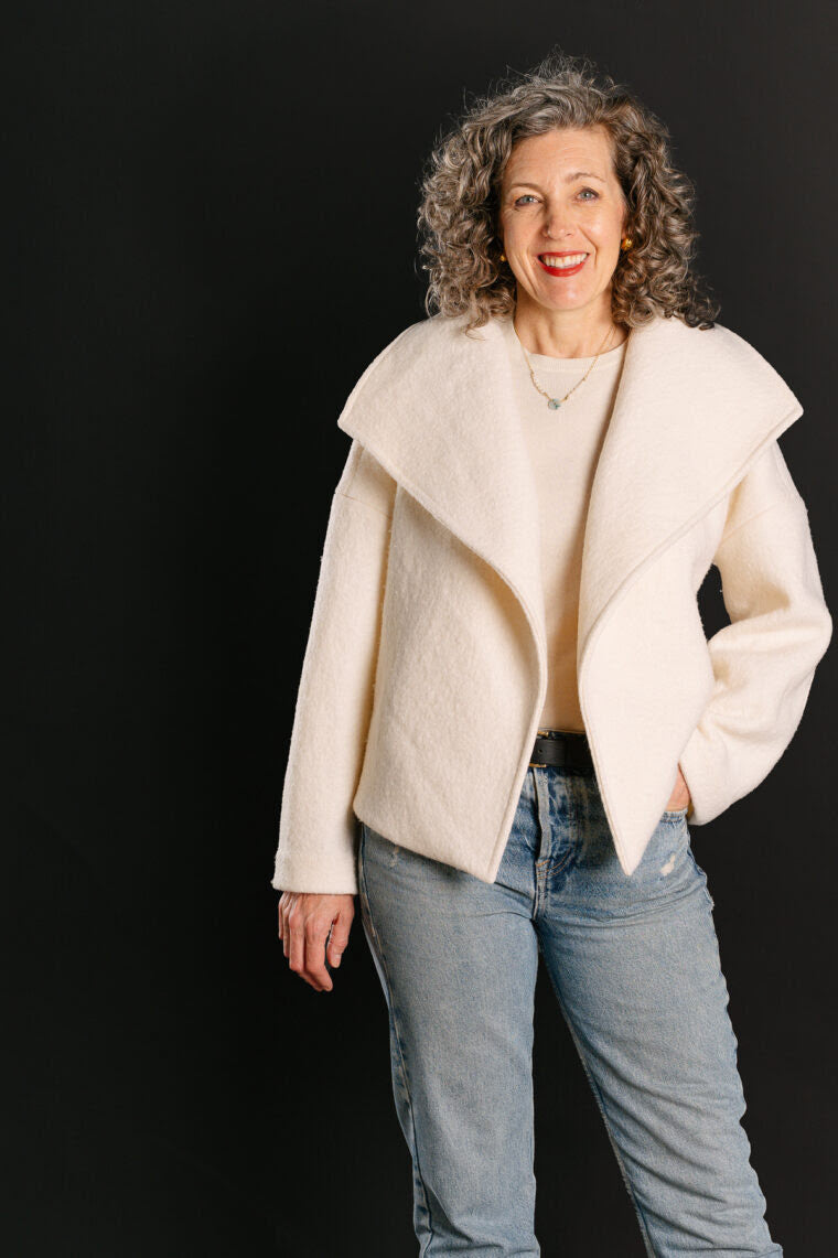 Woman wearing the Helsinki Jacket sewing pattern from Liesl + Co on The Fold Line. A jacket pattern made in linen, canvas, denim, brocade, or wool coating fabric, featuring a relaxed fit, oversized collar, dropped sleeves, and side pockets.